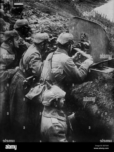 German Ww1 Machine Gun Crew Firing From A Trench On The Eastern Stock