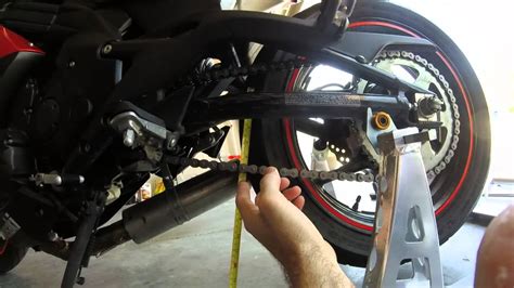 It is sort of backwards slack. Adjusting Chain Slack On A Ninja 650 - YouTube