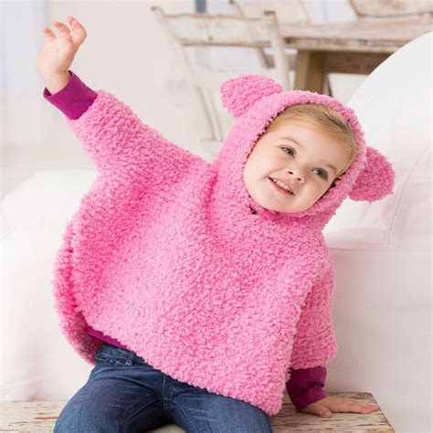 The pattern includes detailed written instructions for four different sizes to fit babies age 6 months, 12 months 18 months, and 24 months old. Playful Hooded Poncho | Red Heart | Baby knitting patterns ...