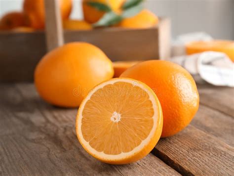 Fresh Juicy Oranges On Wooden Table Stock Photo Image Of Sour