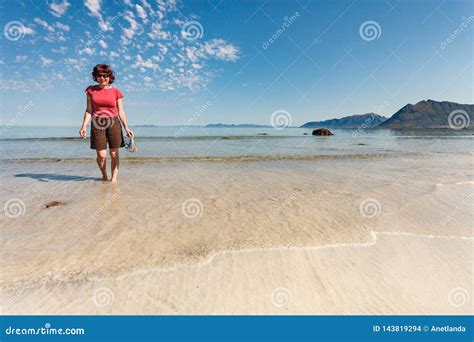 Woman Walking On Sandy Beach Lofoten Norway Stock Photo Image Of