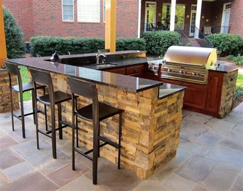 But take it easy outside by entertaining in your outdoor kitchen. U shape outdoor kitchen island with bar top and pergola ...