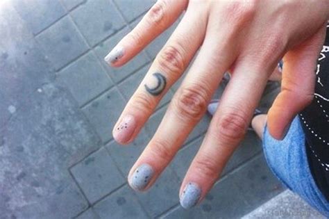 The best area to get this design inked is on the upper portion of your middle finger. 39 Lovely Moon Tattoos On Finger