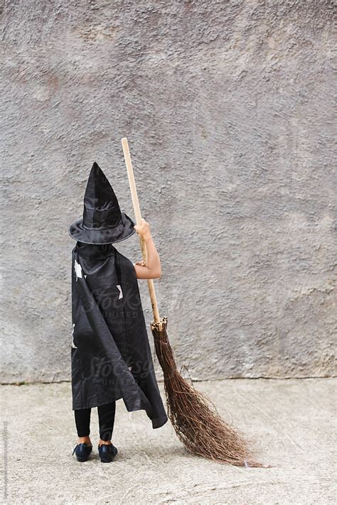 Little Girl Witch Costume With A Broom By Stocksy Contributor Screen