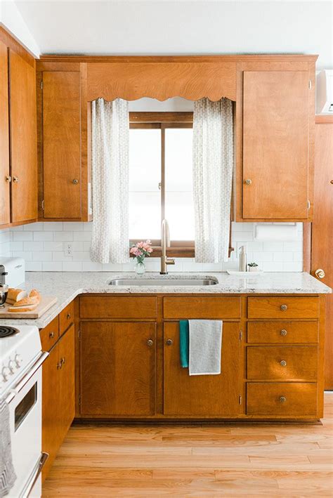 The ultimate white kitchen idea, it creates a light and airy space where the units blend into the kitchen walls. Our Budget Friendly Mid-Century Kitchen Makeover | Vintage ...