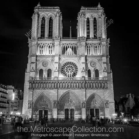 Black And White Picture Of Notre Dame Cathedral At Night In Paris