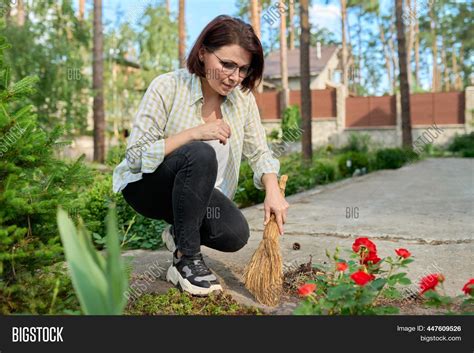 woman sweeping broom image and photo free trial bigstock