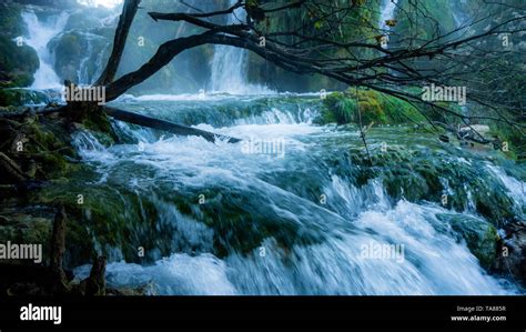 Misty Waterfall And Lake Within The Colorful Plitvice National Park In