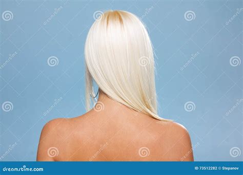 Back View Of Woman With Long Hair Posing At Studio Isolated On Blue