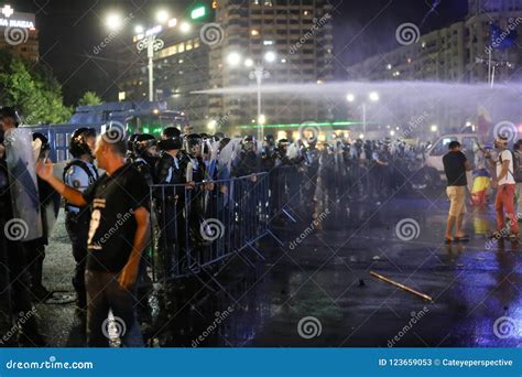 Riot Police Deploy A Water Cannon Against Protesting Crowds Editorial