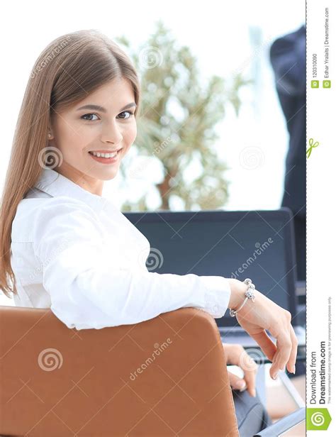 Rear Viewfemale Assistant Looking At The Camera Stock Photo Image