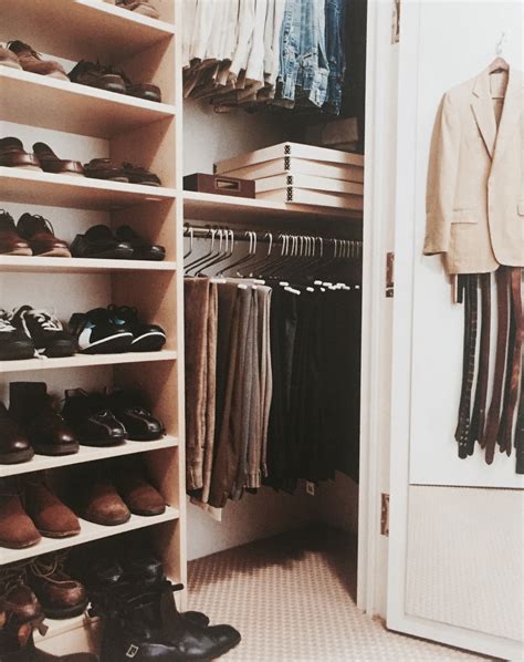 A Closet Filled With Lots Of Shoes Next To An Open Door And Clothes