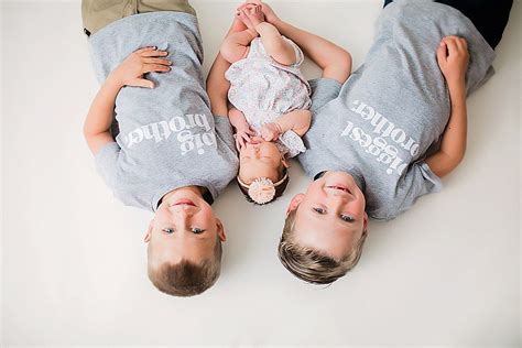 Cute Pose Of Brothers And Sisters For Newborn Photoshoot In Studio
