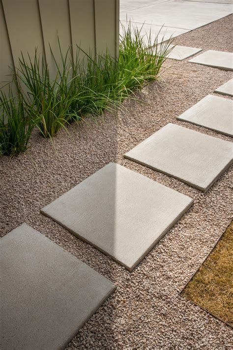 Concrete Pavers In A Gravel Path Lead The Way To The Front Door Drought Tolerant Grasses Line