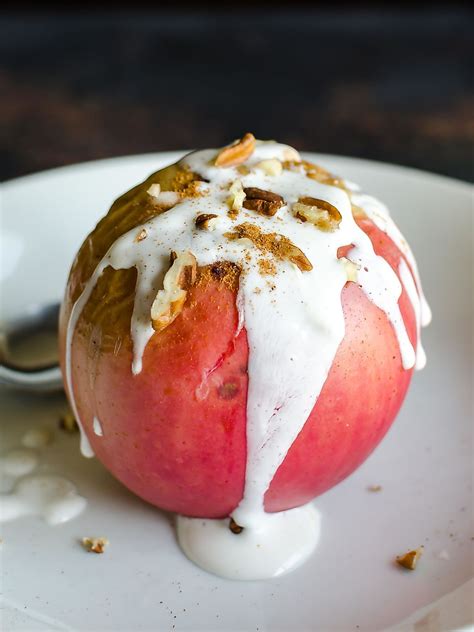 Healthy Baked Apple With Creamy Yogurt Sauce Dripping Down The Sides And Topped With Chopped