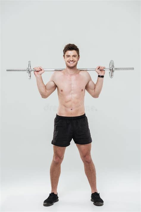Young Healthy Man Athlete Doing Exercises With Barbell Stock Image