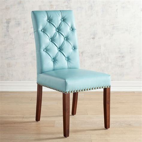 Blue leather dining chairs at an antique dining table finished with two gray arm chairs at the ends in transitional dining room design. Hudson Aqua Blue Dining Chair | Everything Turquoise