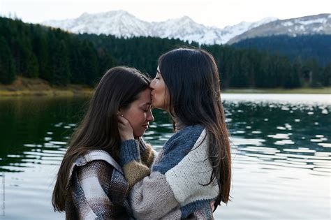 Young Lesbian Couple Sharing A Kiss In Nature By Stocksy Contributor