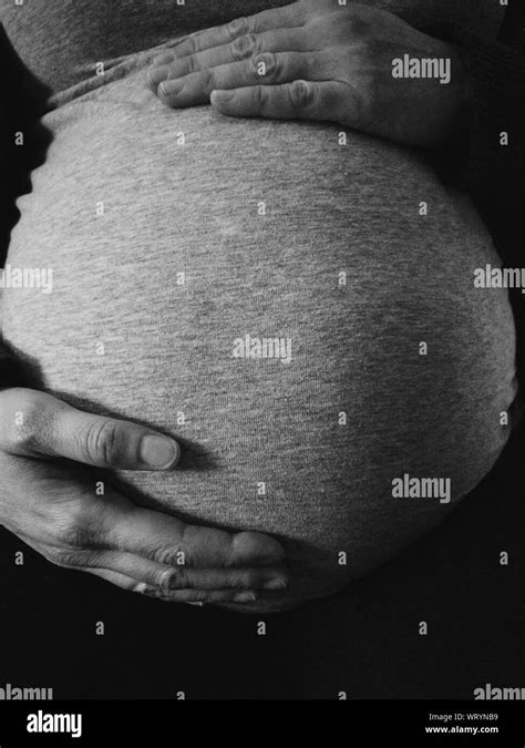 Pregnant Touching Belly Hi Res Stock Photography And Images Alamy