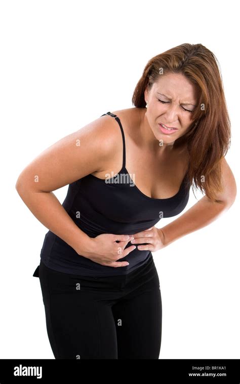 Woman Holds Her Stomach And Bends Over In Pain From Abdominal Cramps