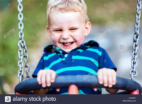 Child On Park Swing Hi Res Stock Photography And Images Alamy