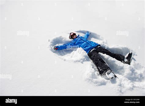 Boy Making Snow Angel Stock Photo Alamy