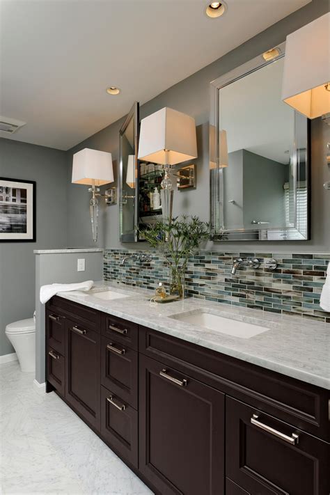 A glass backsplash provides a stunning shine. Contemporary Hotel-Style Bathroom With Glass-Tile ...