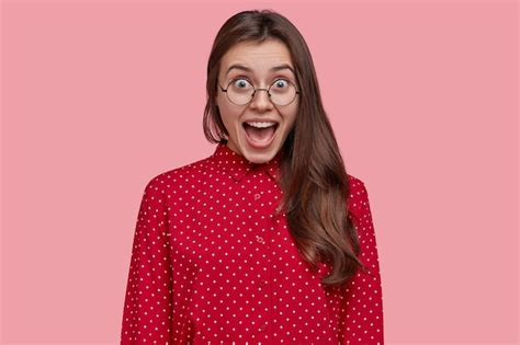 Free Photo Attractive Brunette Overjoyed Woman Opens Mouth And Yells From Joy Wears Pink