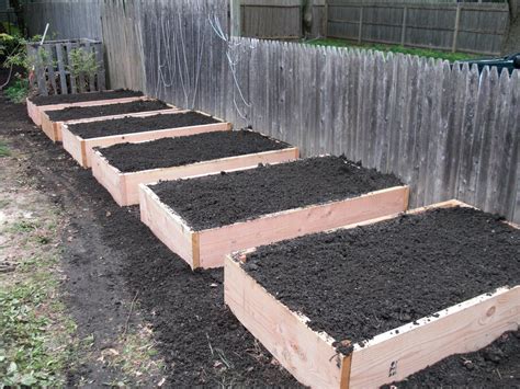 This vegetable garden features three cedar raised beds and is part of an overall drought elevating them helps to separate your fertilized soil from the native soil in the ground, allowing you to. building raised bed gardens | Above ground garden ...