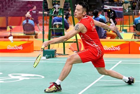 Professional players and their racquets. Dan Lin of China strteches for a shot during badminton ...