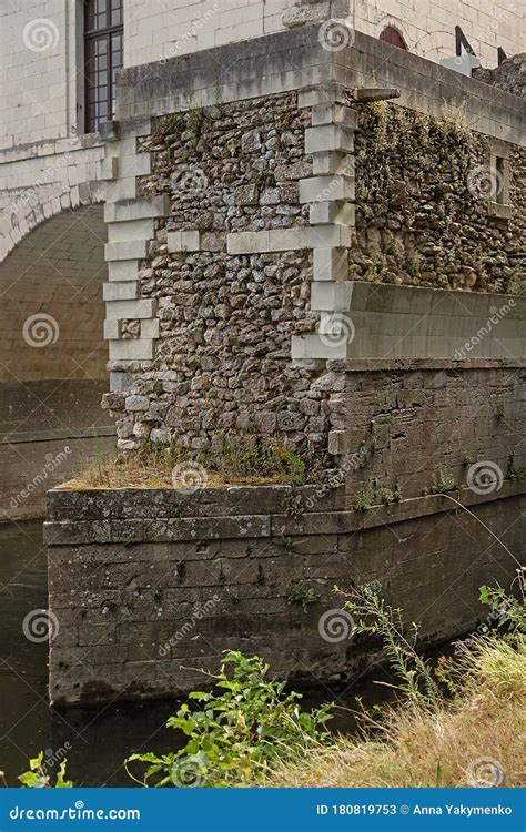 Elements Of An Ancient Cobblestone Bridge Over A River Stock Image
