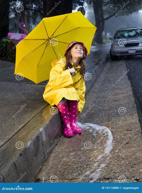 Young Caucasian Girl Playing In The Rain Stock Photo Image Of