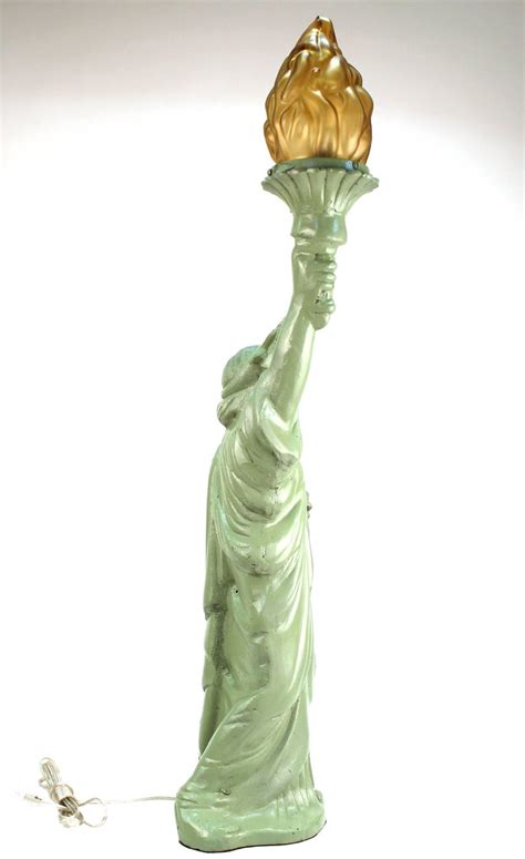 While most floor lamps have straight stems, arc lamps feature a curving arm that can easily reach up and over seating areas, casting their light at a point away from the base. Statue of Liberty Iron Table Lamp For Sale at 1stdibs