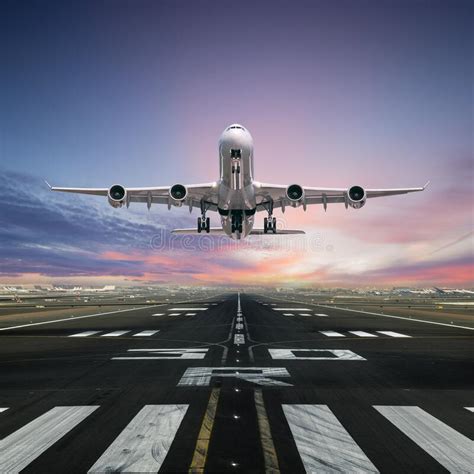 Airplane Taking Off From The Airport Runway Stock Image