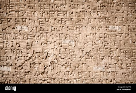 Ancient Sumerian Stone Carving With Cuneiform Scripting Stock Photo