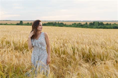 Premium Photo Beautiful Woman In Dress On A Wheat Field