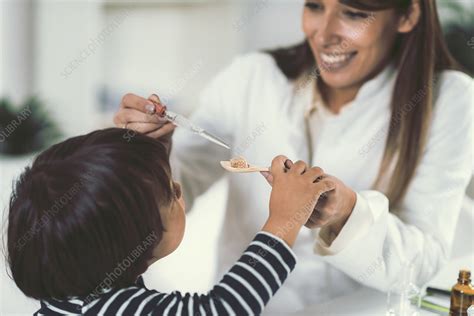 Homeopath Giving Remedy To Child Stock Image F0245220 Science