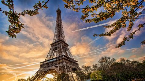 Paris Eiffel Tower France With Background Of Blue Sky And Clouds During