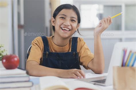 Happy Asian Girl Learning Online At Home Stock Photo By Ijeab Photodune