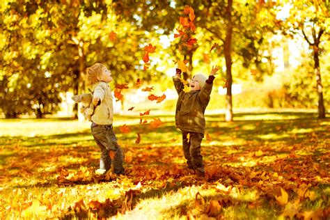 Children Playing With Autumn Fallen Leaves In Park Made In A Pinch