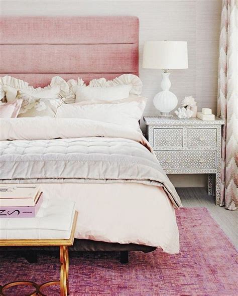Feminine bedroom interior with a double bed with dotted sheets, armchair, art collection and plants. 55 Adorable Feminine Bedroom Decor Ideas | ComfyDwelling.com