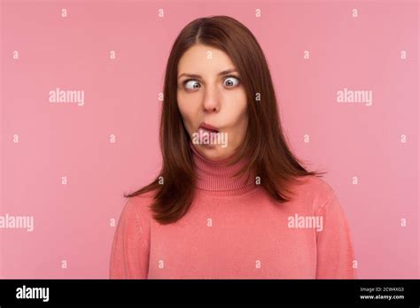 Closeup Portrait Of Funny Crazy Woman Crossing Eyes And Showing Tongue Having Fun Making Dumb