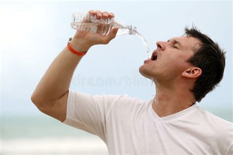 Man Drinking Water From Bottle Stock Photo Image Of Vacation Beach