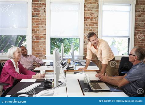 Group Of Workers At Desks In Modern Design Office Stock Photo Image