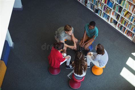 Students Interacting With Each Other In Library Stock Image Image Of