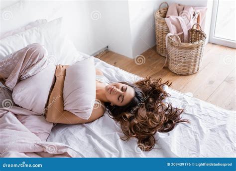 Brunette Woman In Pajama Lying With Stock Photo Image Of Morning