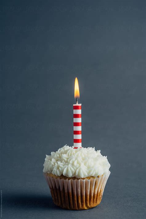 Cupcake With Birthday Candle On A Charcoal Background By Stocksy