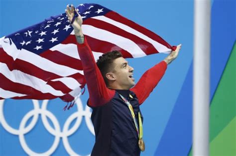 Swimming Olympic Champion Ervin Kneels During Us Anthem