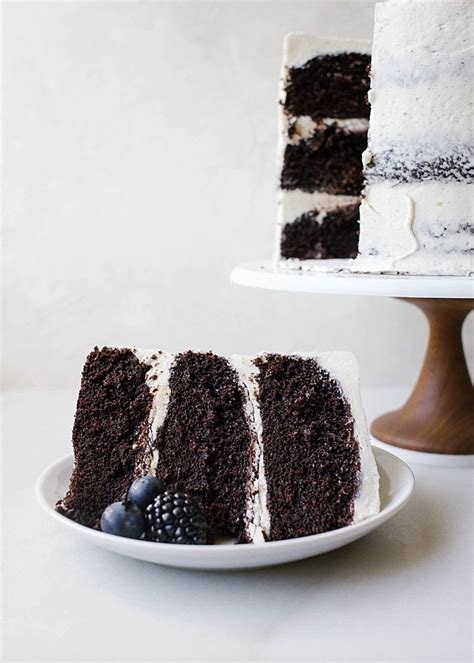 White and black ceramic figurine, cheesecake, chocolate, cherries, dessert. Black and White Cake - Wood & Spoon