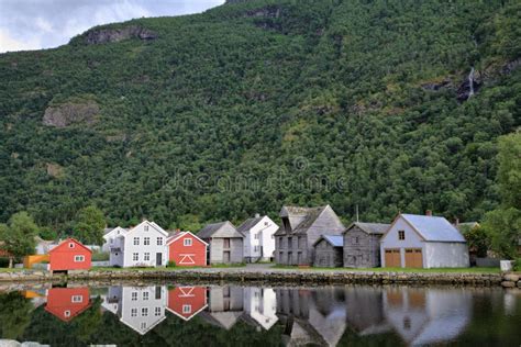 Norwegian Houses Reflecting In The Water In Laerdal Norway Stock